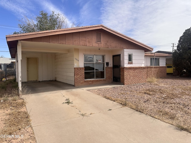 5829 Nike Ln, El Paso, TX 79924 - single story home featuring brick siding, concrete driveway, and an attached carport