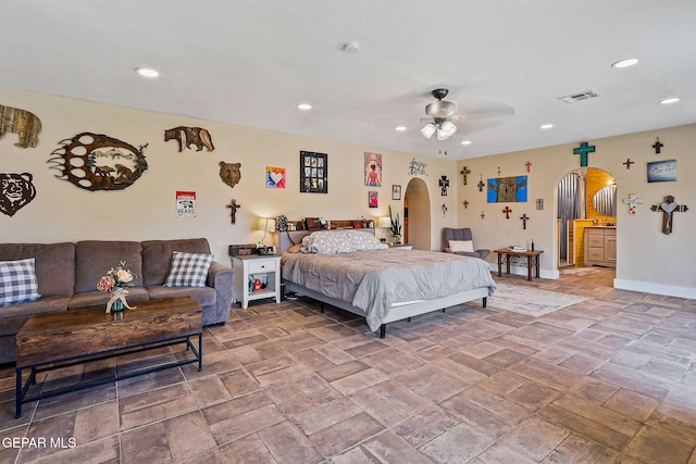 1624 Vinton Rd, Anthony, NM 88021 - bedroom featuring arched walkways, recessed lighting, and stone finish floors