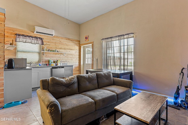 1624 Vinton Rd, Anthony, NM 88021 - living area featuring a wall mounted AC, wood walls, and light tile patterned floors