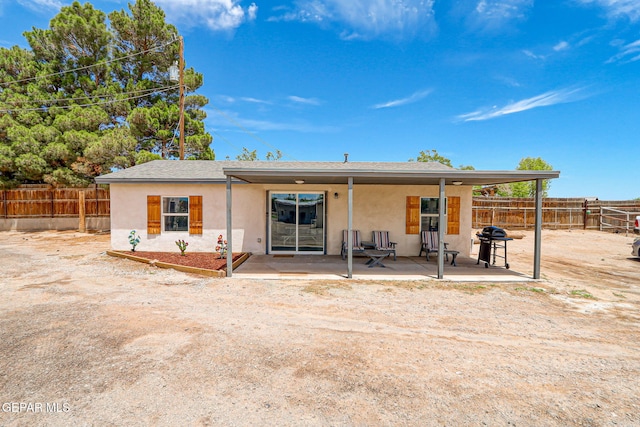 1624 Vinton Rd, Anthony, NM 88021 - back of house with stucco siding, a patio, a fenced backyard, and roof with shingles