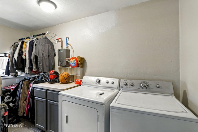 1624 Vinton Rd, Anthony, NM 88021 - washroom featuring washing machine and clothes dryer, cabinet space, and tile patterned flooring