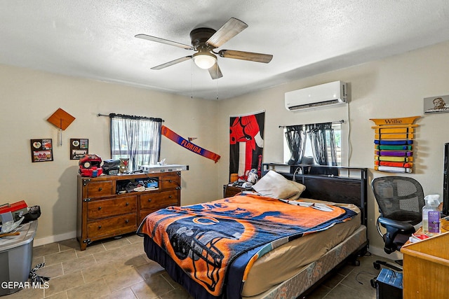 1624 Vinton Rd, Anthony, NM 88021 - tiled bedroom featuring an AC wall unit, a textured ceiling, and a ceiling fan