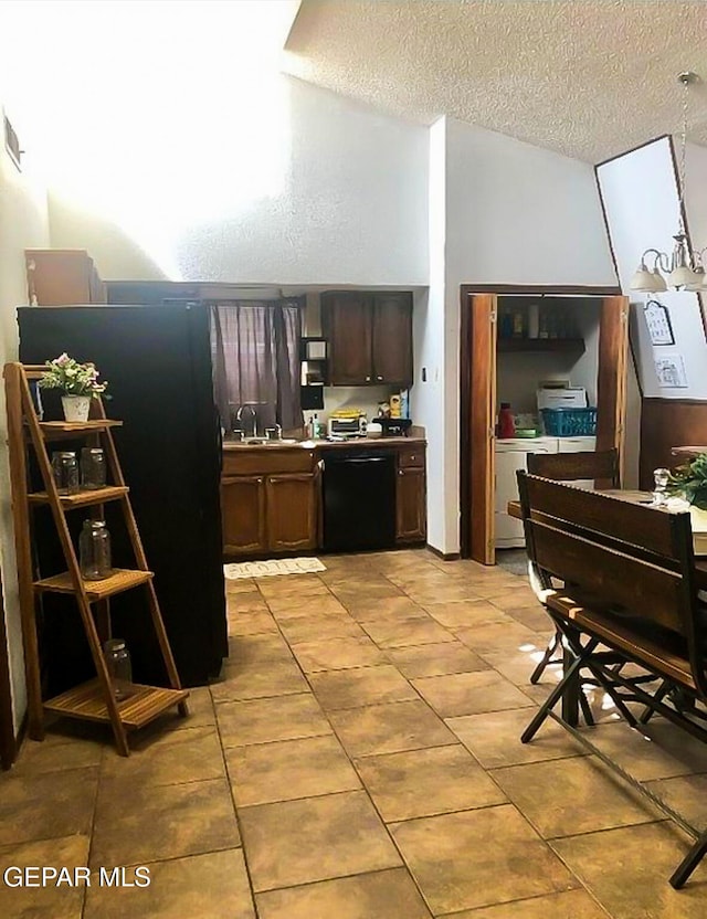 1624 Vinton Rd, Anthony, NM 88021 - kitchen featuring black appliances, a textured ceiling, light tile patterned flooring, and dark brown cabinets