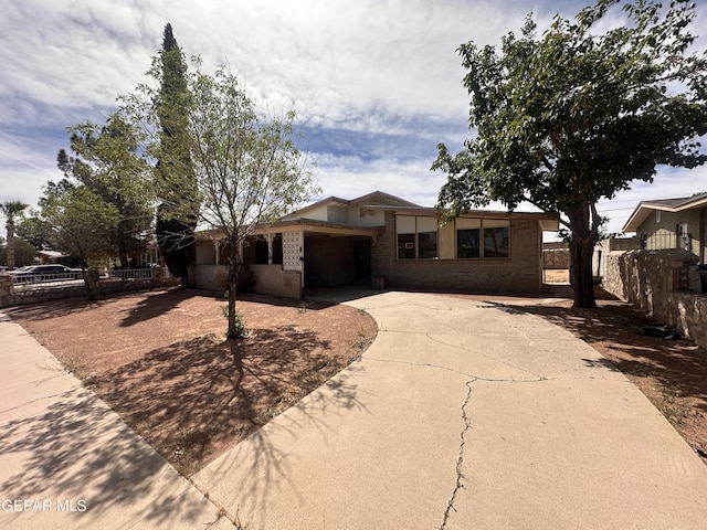 5204 Antonio Ave, El Paso, TX 79924 - view of front of house with concrete driveway and brick siding