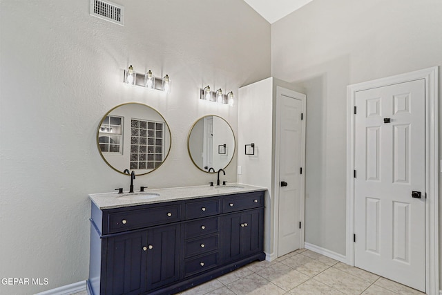 8921 Gemotes Pl, El Paso, TX 79907 - bathroom with double vanity and tile patterned floors
