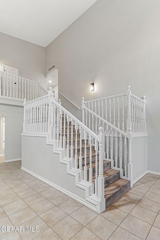 8921 Gemotes Pl, El Paso, TX 79907 - stairs featuring tile patterned flooring and baseboards