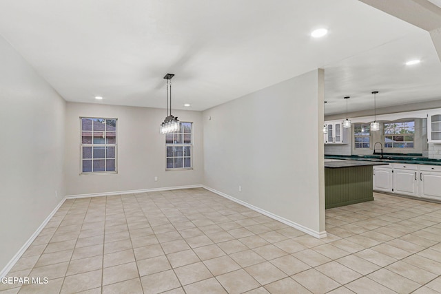 8921 Gemotes Pl, El Paso, TX 79907 - unfurnished dining area featuring recessed lighting and light tile patterned floors