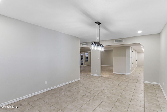 8921 Gemotes Pl, El Paso, TX 79907 - empty room featuring arched walkways, light tile patterned flooring, and recessed lighting