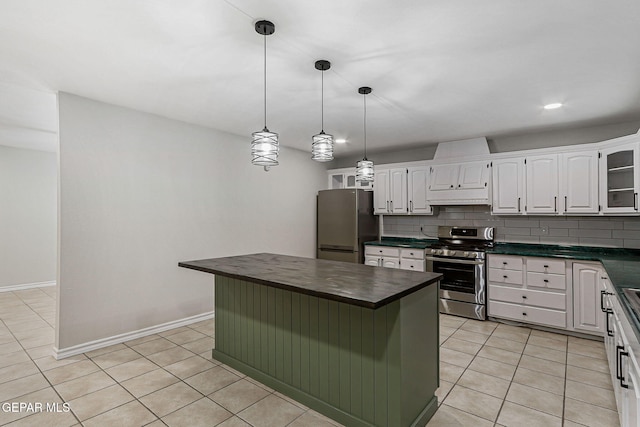 8921 Gemotes Pl, El Paso, TX 79907 - kitchen featuring stainless steel appliances, under cabinet range hood, light tile patterned flooring, and white cabinetry