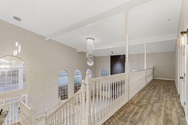 8921 Gemotes Pl, El Paso, TX 79907 - hall with an upstairs landing, beam ceiling, wood finished floors, and a chandelier