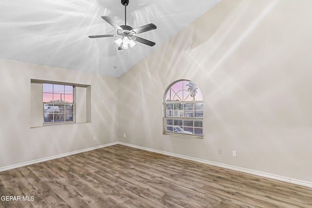 8921 Gemotes Pl, El Paso, TX 79907 - unfurnished room featuring wood finished floors, vaulted ceiling, and ceiling fan