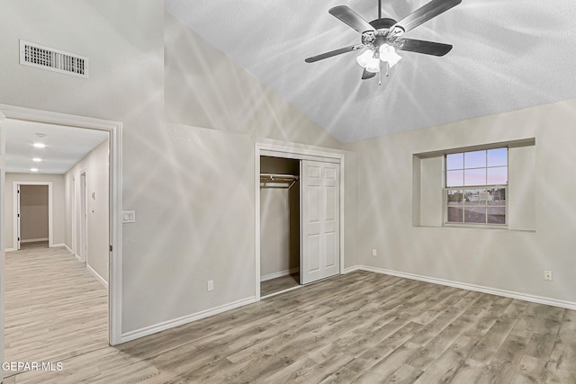 8921 Gemotes Pl, El Paso, TX 79907 - unfurnished bedroom featuring wood finished floors, a closet, a ceiling fan, and a textured ceiling