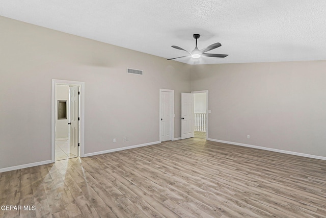 8921 Gemotes Pl, El Paso, TX 79907 - empty room featuring light wood finished floors, ceiling fan, and a textured ceiling