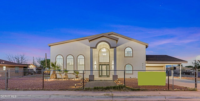 8921 Gemotes Pl, El Paso, TX 79907 - view of front of home with a fenced front yard, stucco siding, and concrete driveway