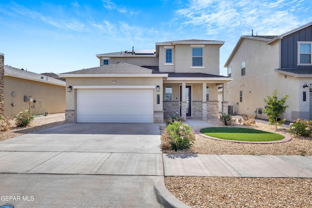 1649 Sam Dominguez, El Paso, TX 79928 - view of front facade featuring a porch, stucco siding, stone siding, a garage, and roof mounted solar panels