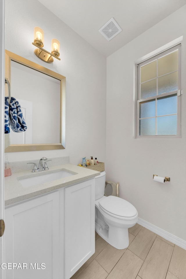 1649 Sam Dominguez, El Paso, TX 79928 - half bathroom with vanity and wood tiled floors