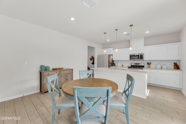1649 Sam Dominguez, El Paso, TX 79928 - dining space with wood tiled floors and recessed lighting