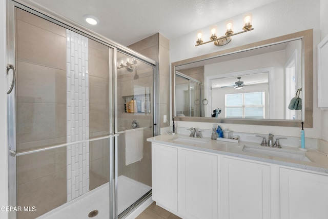 1649 Sam Dominguez, El Paso, TX 79928 - full bathroom with a shower stall, a ceiling fan, and double vanity