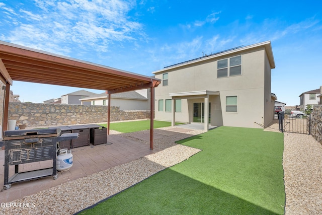 1649 Sam Dominguez, El Paso, TX 79928 - rear view of house featuring a fenced backyard, a gate, stucco siding, and a patio