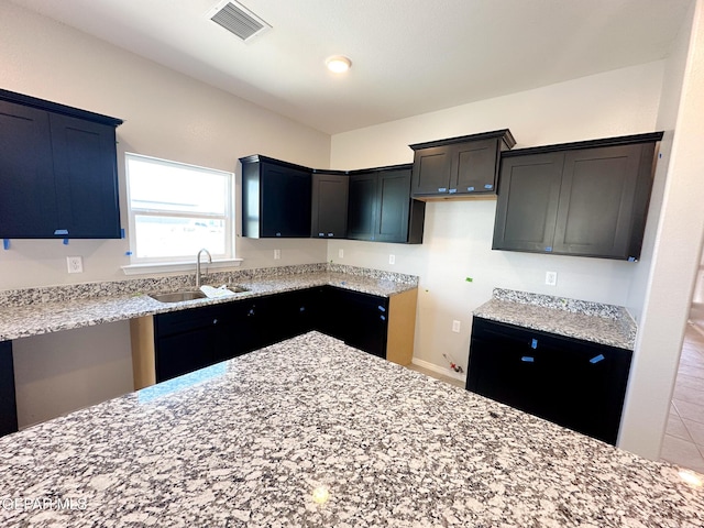 12577 Polo Norte Dr, El Paso, TX 79934 - kitchen featuring a sink and light stone countertops
