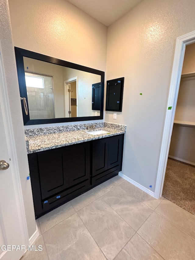 12577 Polo Norte Dr, El Paso, TX 79934 - full bathroom featuring vanity and a walk in closet