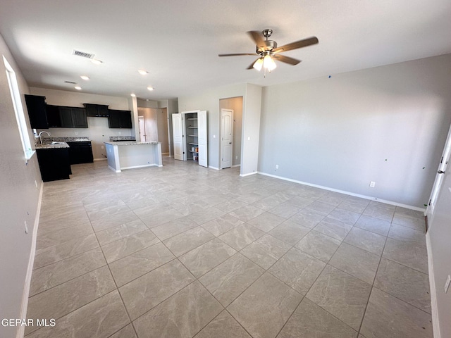 12577 Polo Norte Dr, El Paso, TX 79934 - unfurnished living room featuring ceiling fan and recessed lighting