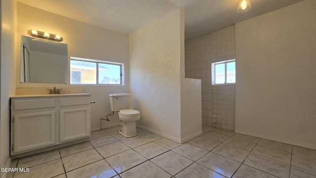 557 Bonampak Dr, San Elizario, TX 79849 - full bathroom with walk in shower, vanity, and tile patterned flooring