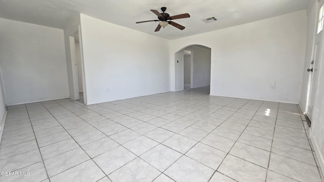 557 Bonampak Dr, San Elizario, TX 79849 - unfurnished room featuring a ceiling fan, arched walkways, and light tile patterned flooring
