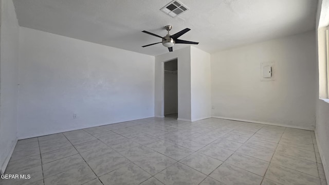 557 Bonampak Dr, San Elizario, TX 79849 - empty room with ceiling fan and tile patterned floors