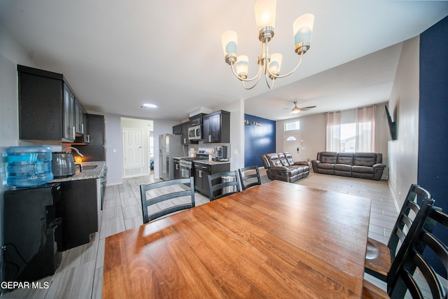 13163 Emerald Isle St, El Paso, TX 79928 - dining area featuring a chandelier, a ceiling fan, and light tile patterned floors