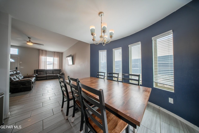 13163 Emerald Isle St, El Paso, TX 79928 - dining area with a chandelier, ceiling fan, and wood tiled floors