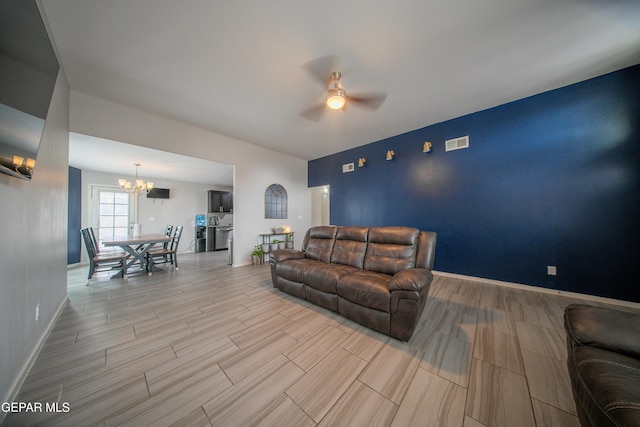 13163 Emerald Isle St, El Paso, TX 79928 - living room with a ceiling fan, a chandelier, and wood tiled floors