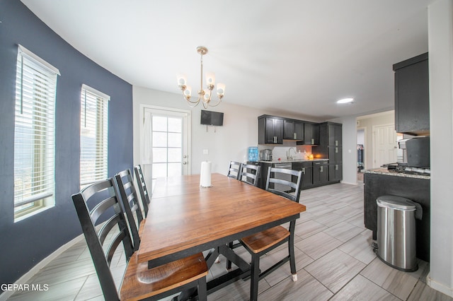 13163 Emerald Isle St, El Paso, TX 79928 - dining area with a chandelier and baseboards