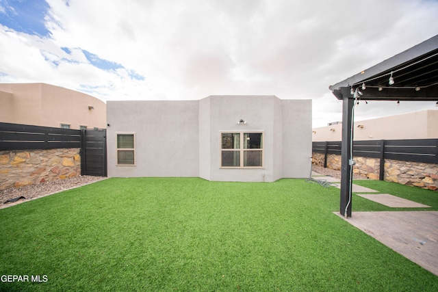 13163 Emerald Isle St, El Paso, TX 79928 - back of property featuring a fenced backyard and stucco siding