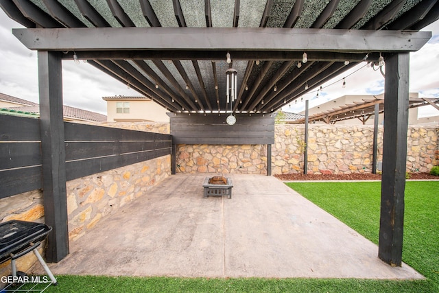 13163 Emerald Isle St, El Paso, TX 79928 - fenced backyard with a patio area and an outdoor fire pit