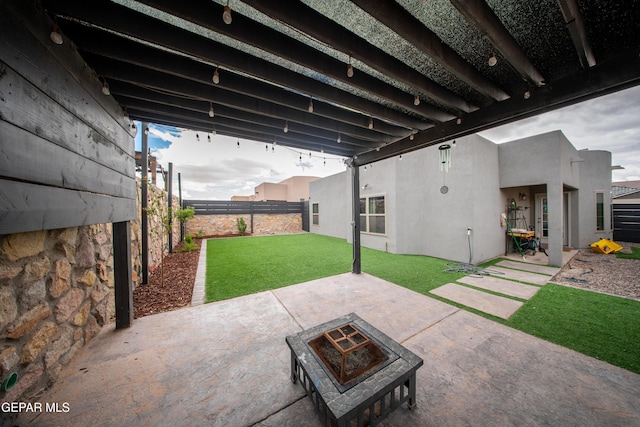 13163 Emerald Isle St, El Paso, TX 79928 - fenced backyard with an outdoor fire pit and a patio