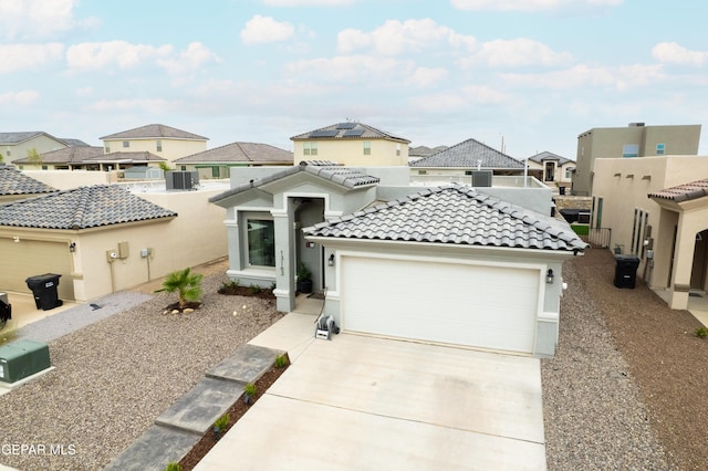 13163 Emerald Isle St, El Paso, TX 79928 - view of front of home with a residential view, driveway, a tile roof, an attached garage, and stucco siding