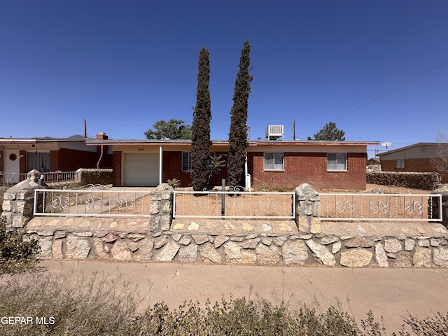 10333 Shoshone St, El Paso, TX 79924 - ranch-style home featuring a fenced front yard, brick siding, and a garage
