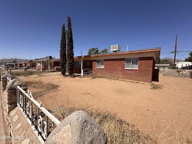 10333 Shoshone St, El Paso, TX 79924 - rear view of property with brick siding