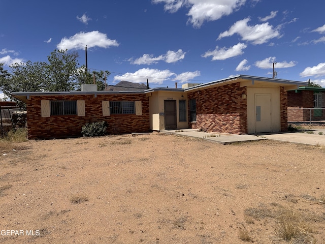 10045 Kellogg St, El Paso, TX 79924 - back of house featuring brick siding