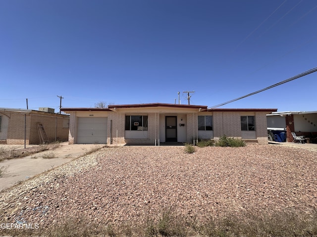 10561 Champlain St, El Paso, TX 79924 - single story home with brick siding, a garage, and concrete driveway