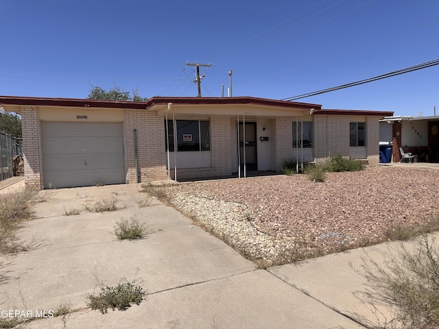 10561 Champlain St, El Paso, TX 79924 - single story home with brick siding, an attached garage, and concrete driveway