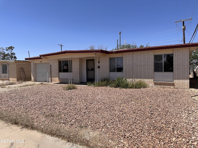 10561 Champlain St, El Paso, TX 79924 - ranch-style home featuring brick siding and a garage