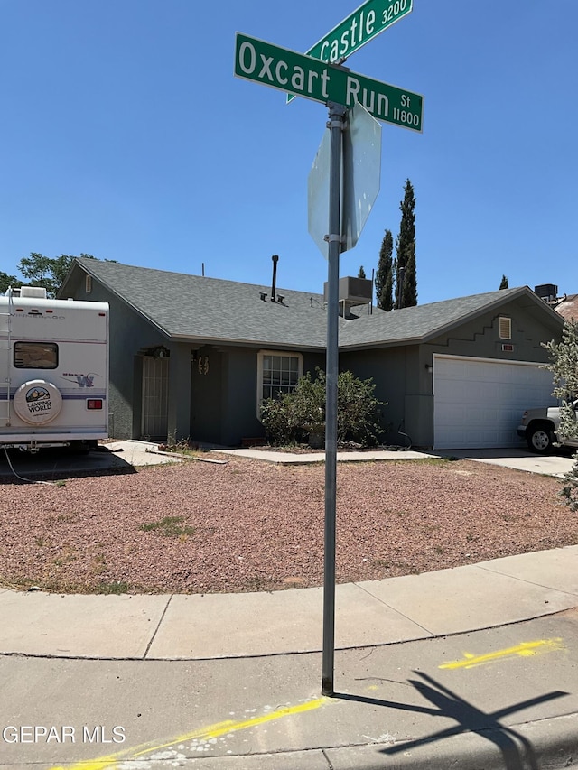 11816 Oxcart Run St, El Paso, TX 79936 - view of front of property featuring an attached garage and a shingled roof