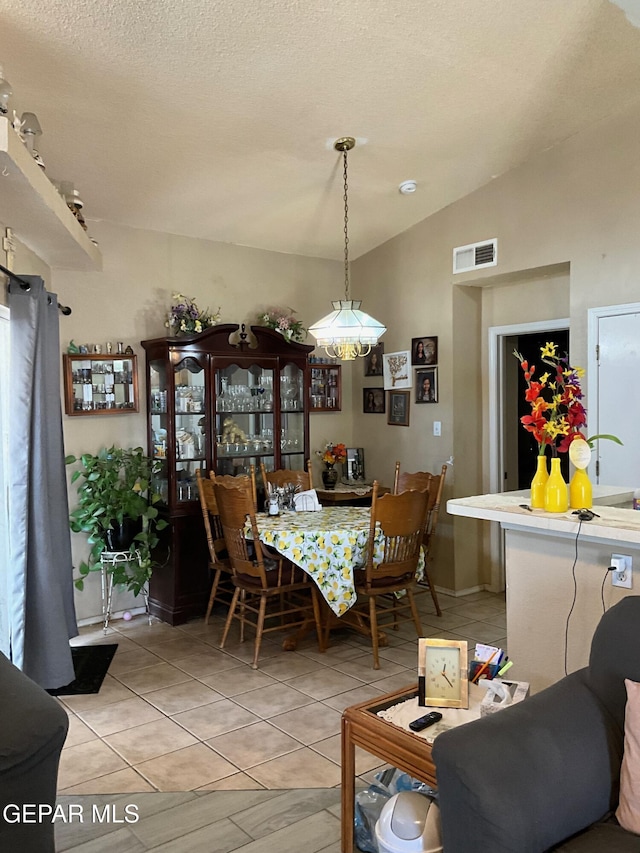 11816 Oxcart Run St, El Paso, TX 79936 - dining space featuring vaulted ceiling and light tile patterned floors