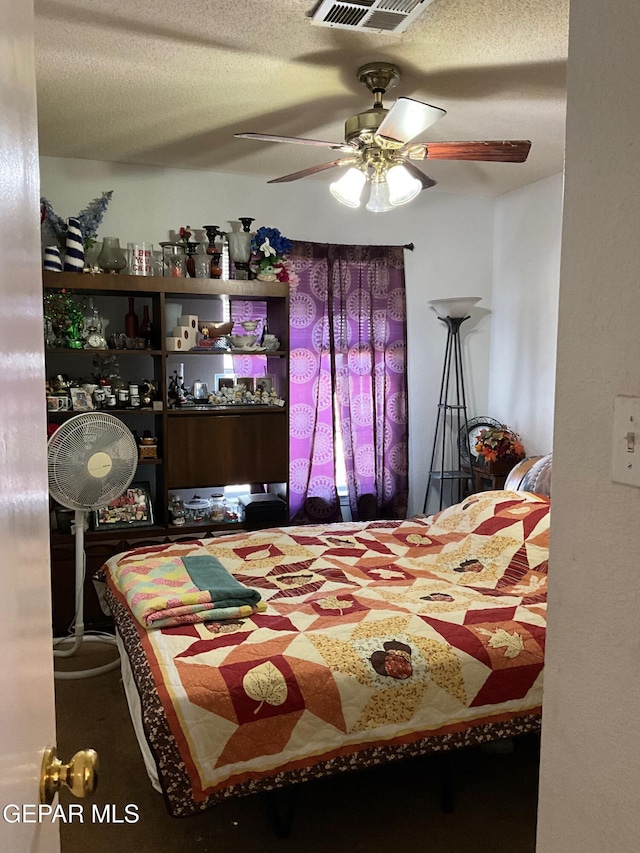 11816 Oxcart Run St, El Paso, TX 79936 - bedroom with a textured ceiling and a ceiling fan