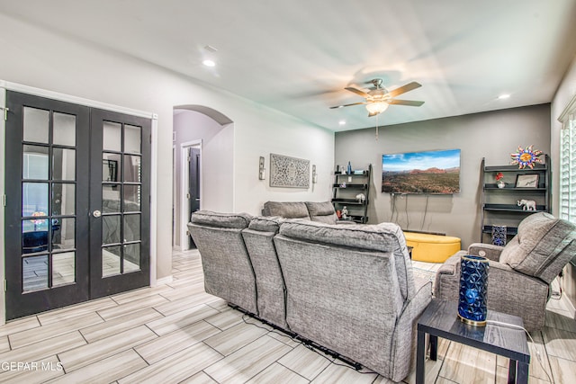 12571 New Dawn Dr, El Paso, TX 79928 - living area featuring arched walkways, a ceiling fan, french doors, recessed lighting, and wood finish floors