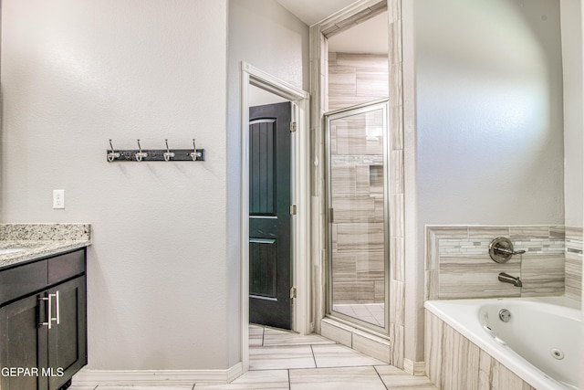 12571 New Dawn Dr, El Paso, TX 79928 - bathroom featuring a shower stall, a jetted tub, and vanity