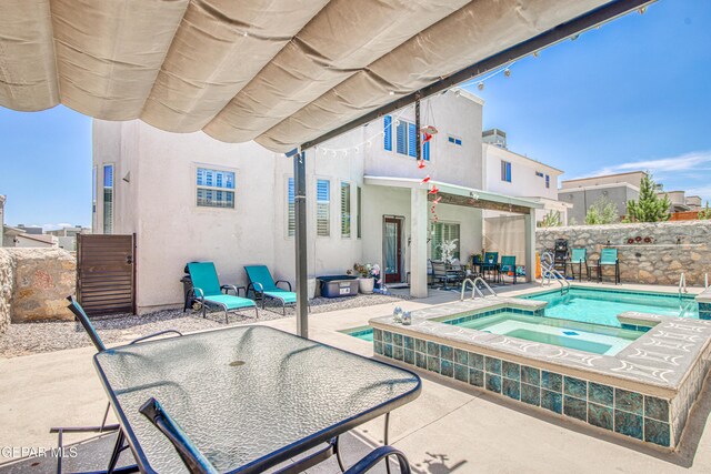 12571 New Dawn Dr, El Paso, TX 79928 - view of pool with a patio, outdoor dining space, and a pool with connected hot tub
