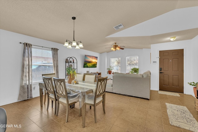 5609 Rick Husband Dr, El Paso, TX 79934 - dining room with lofted ceiling, a chandelier, a ceiling fan, and a textured ceiling